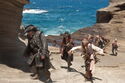 A blindfolded Captain Jack Sparrow (Johnny Depp) is led by Blackbeard (Ian McShane) and Angelica (Penelope Cruz) onto the rocky shore of the island where the fabled Fountain of Youth is believed to be located.