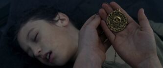  taking the medallion from .