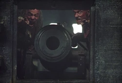  and  behind a gun port.