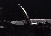 A flintlock igniting
( Credit goes to wikipedia for the image )