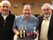 Multiple PEZ dispensers made of Ratzenberger's characters, with John Lasseter