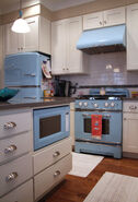 The kitchen of the UP house with its retro powder blue appliances.