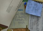 A note on Andy's bulletin board showing the names of Carl and Ellie from Up.