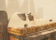 WALL•E and EVE on the WALL•E transport vehicle (EVE is inside of the barrel)