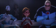 Evelyn behind Frozone, Elastigirl, and Mr. Incredible.