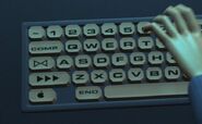 An Apple key on the computer of Syndrome's manta jet