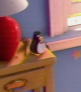 Wheezy on Andy's nightstand in the old home videos in Toy Story 3