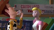 Bo Peep drops her shepherd's crook and then kisses Woody.