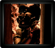 O monitor mostrando William Afton em chamas, durante o Final Bom.