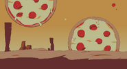 Background #1. A desert with giant pizzas in the background.