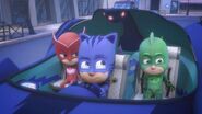 Catboy driving the Cat-Car to catch up with Romeo and Robot