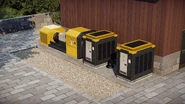 A diesel generator next to a backup battery.