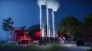 A geothermal power plant at night, shedding heat in the form of steam.