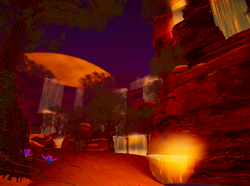 A waterfall location with beautiful flowers.