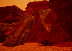 These rock triangles mark the entrance of the Zeolite Cave at 345:157:1810 near the Sand Falls. It is open from the beginning of the game.