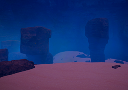 This desert location has strange pink sand and an unnatural dark blue sky.
