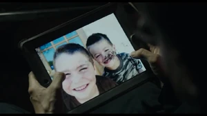 Dreyfus views photos of his lost family.