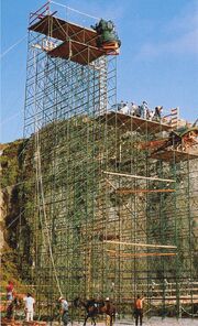 Scaffold holding the partial replica head and torch