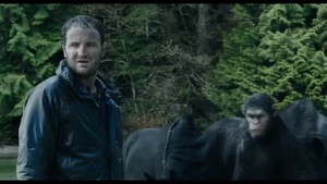 Malcolm and Caesar observe Caesar's infant son.