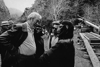 John Huston on set with Roddy McDowall and Natalie Trundy