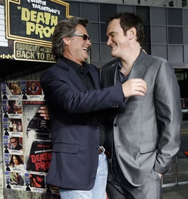 Kurt Russell smiles with director Quentin Tarantino