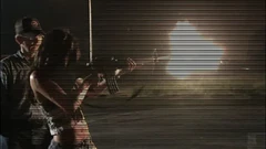 With the rifle.