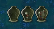 A set of three transparent zombie vases, with one empty and the other two containing a zombie and a gargantuar.