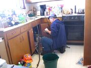 800px-Plumber at work.jpg