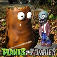 A model of a zombie and a third-stage Tall-nut piggy bank made by Roogo