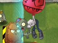 A Balloon Zombie eating whilst flying with his balloon. Note the bone poking out of his elbow.