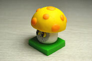 Costumed Sun-shroom figure