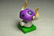 Costumed Puff-shroom figure