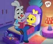 Mauro reading a book to her.