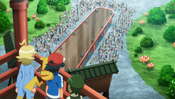 Ash, Clemont and Sawyer notice people at a runway