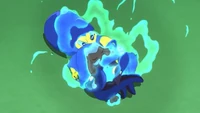 Ash's Riolu charging its attack with Aura.