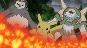 Pikachu fighting the flame spirit with Pangoro and Chesnaught