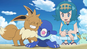 Popplio being nuzzled by Sandy