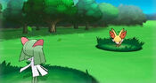 Fennekin battling a Kirlia