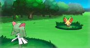 Fennekin battling a Kirlia