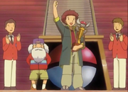 Tyson, the winner, with the Hoenn League Championship Trophy.