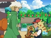 Ash with the Twinleaf Festival Battle tournament trophy.