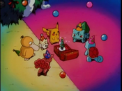 The Pokémon gather around the music box