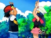 Ash and Dawn high-five for victory