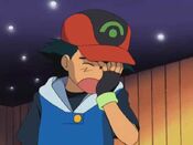 Ash facepalms, seeing Pikachu has not mastered Iron Tail