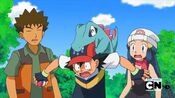 Totodile gnaws on Ash's head