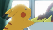 Lillie passes Pikachu a bowl with food in it