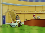 Officer Jenny parks in front of the Pokémon Center's counter