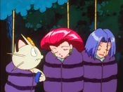 Meowth attempts to wake Jessie and James