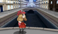 Serena on a bridge over a body of water, overlooking Lumiose City's symbol