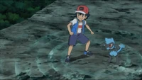 Ash and his Riolu, using Aura.